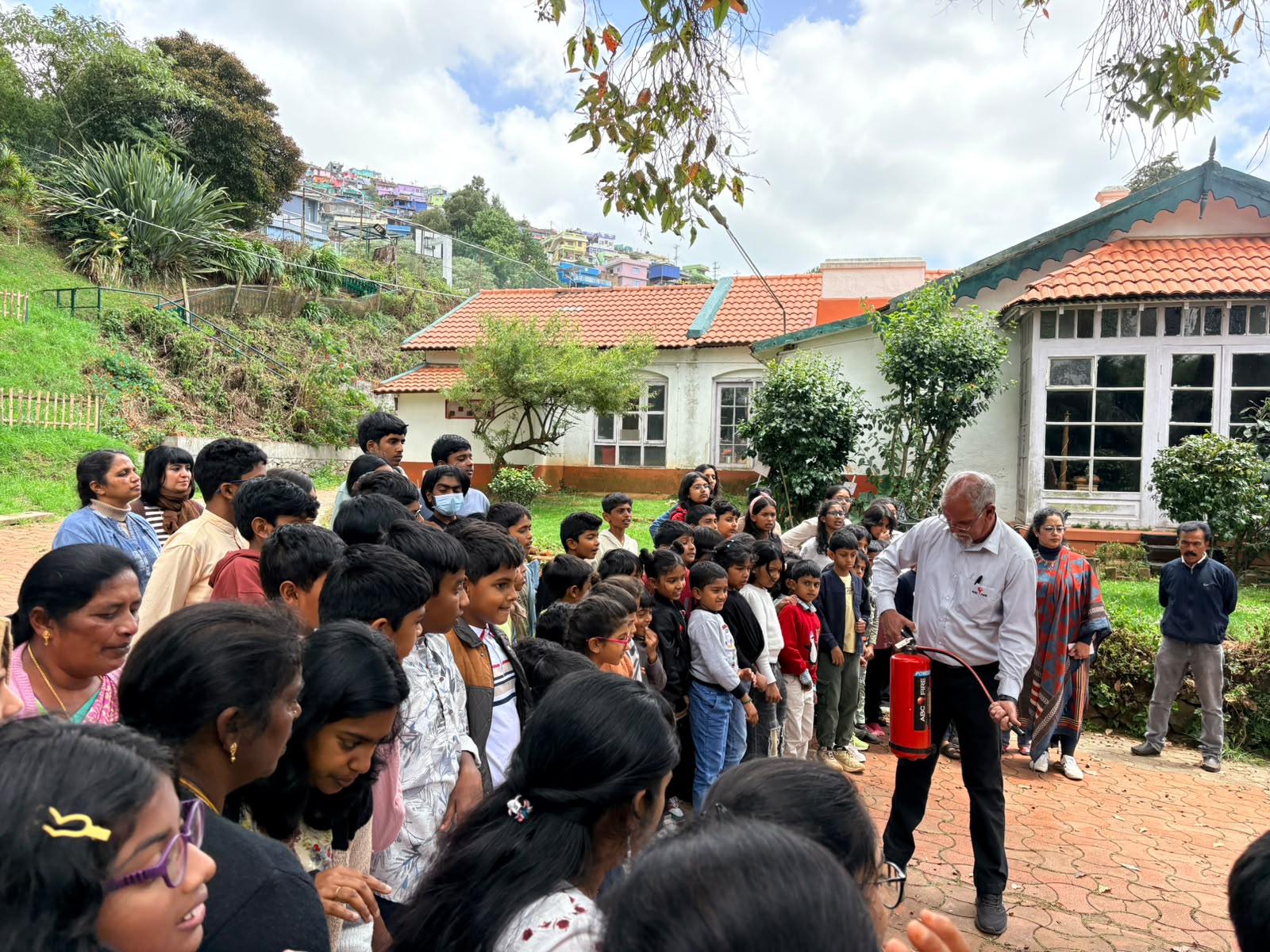 Students gathered to watch the fire extinguisher demonstration during the BMS fire safety drill