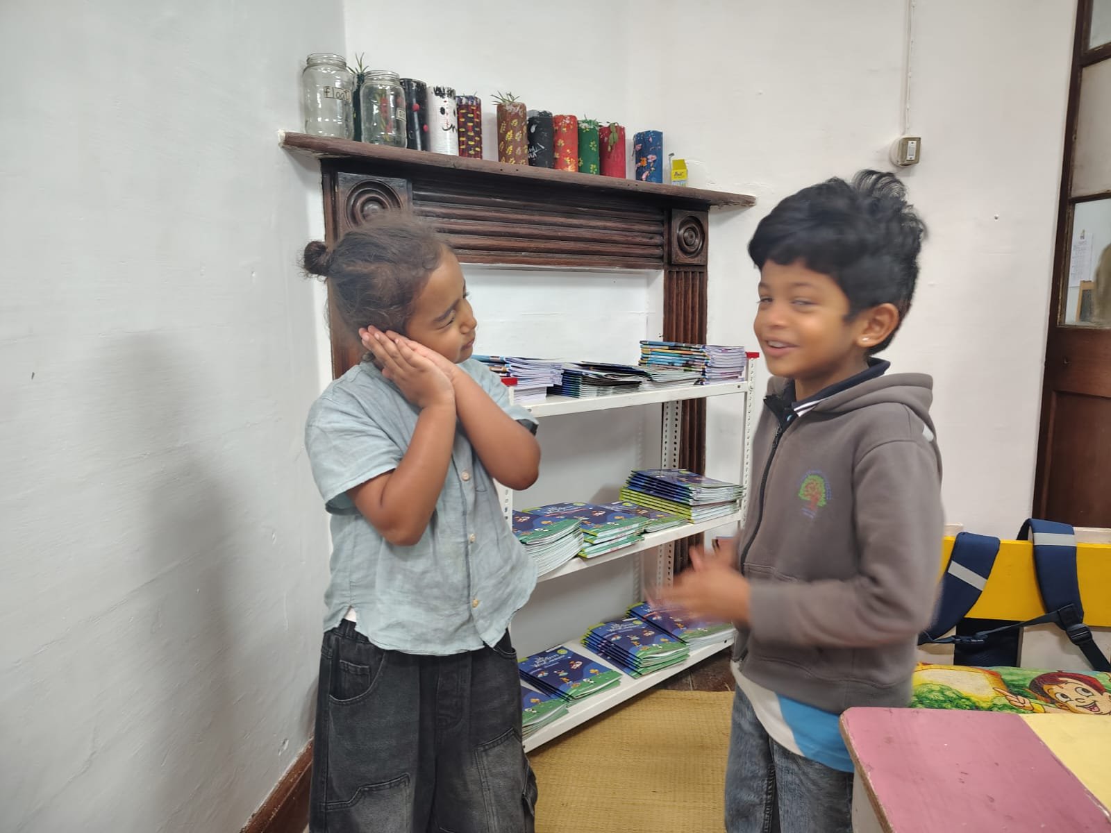 First Step children acting out action words in the classroom at bms