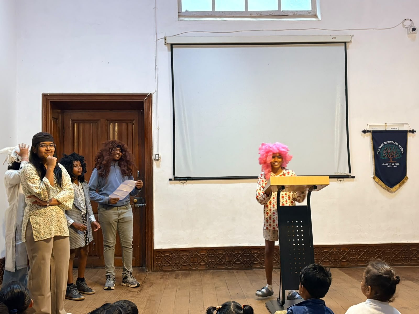 Grade 8 students performing at their class assembly