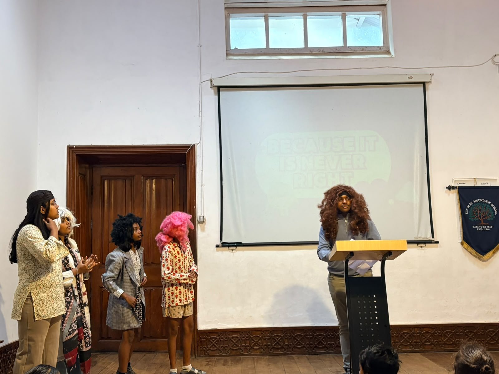 Grade 8 students performing at their class assembly