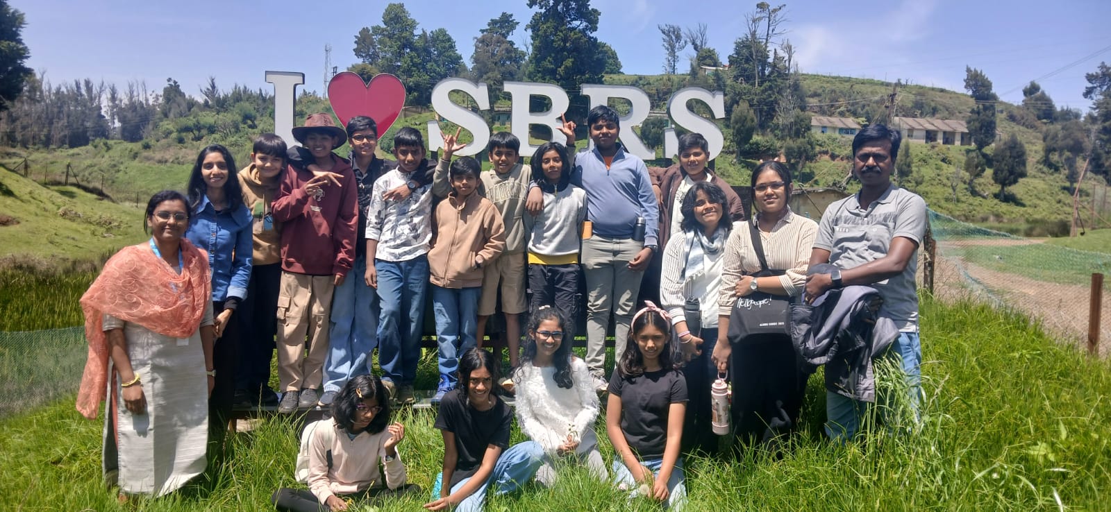 The whole group posing at the 'I heart SBRS' sign