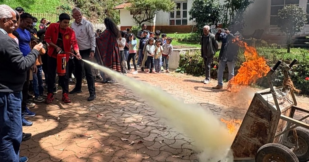 Students watching a fire safety demonstration