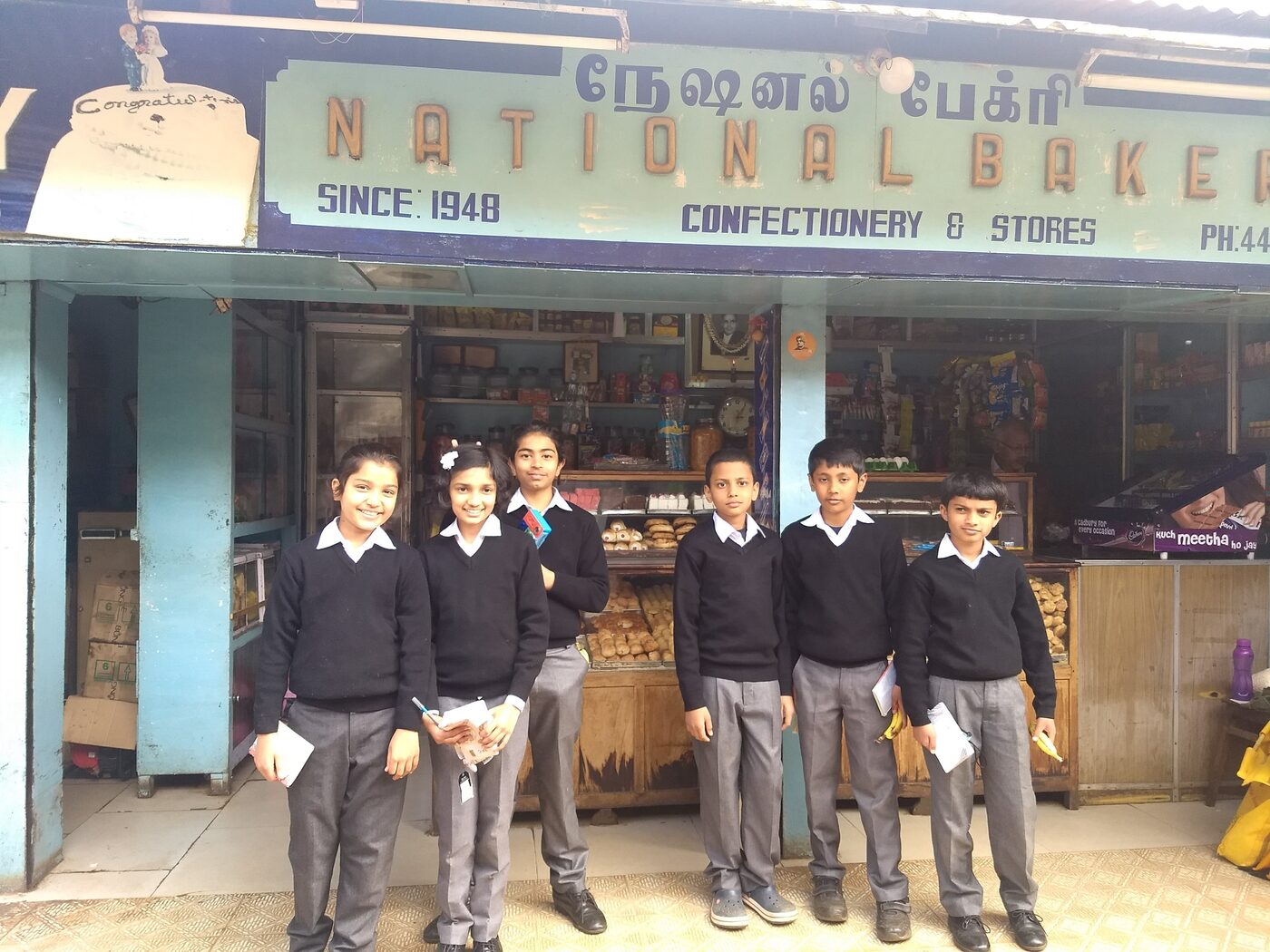 Students outside National Bakery, since 1948