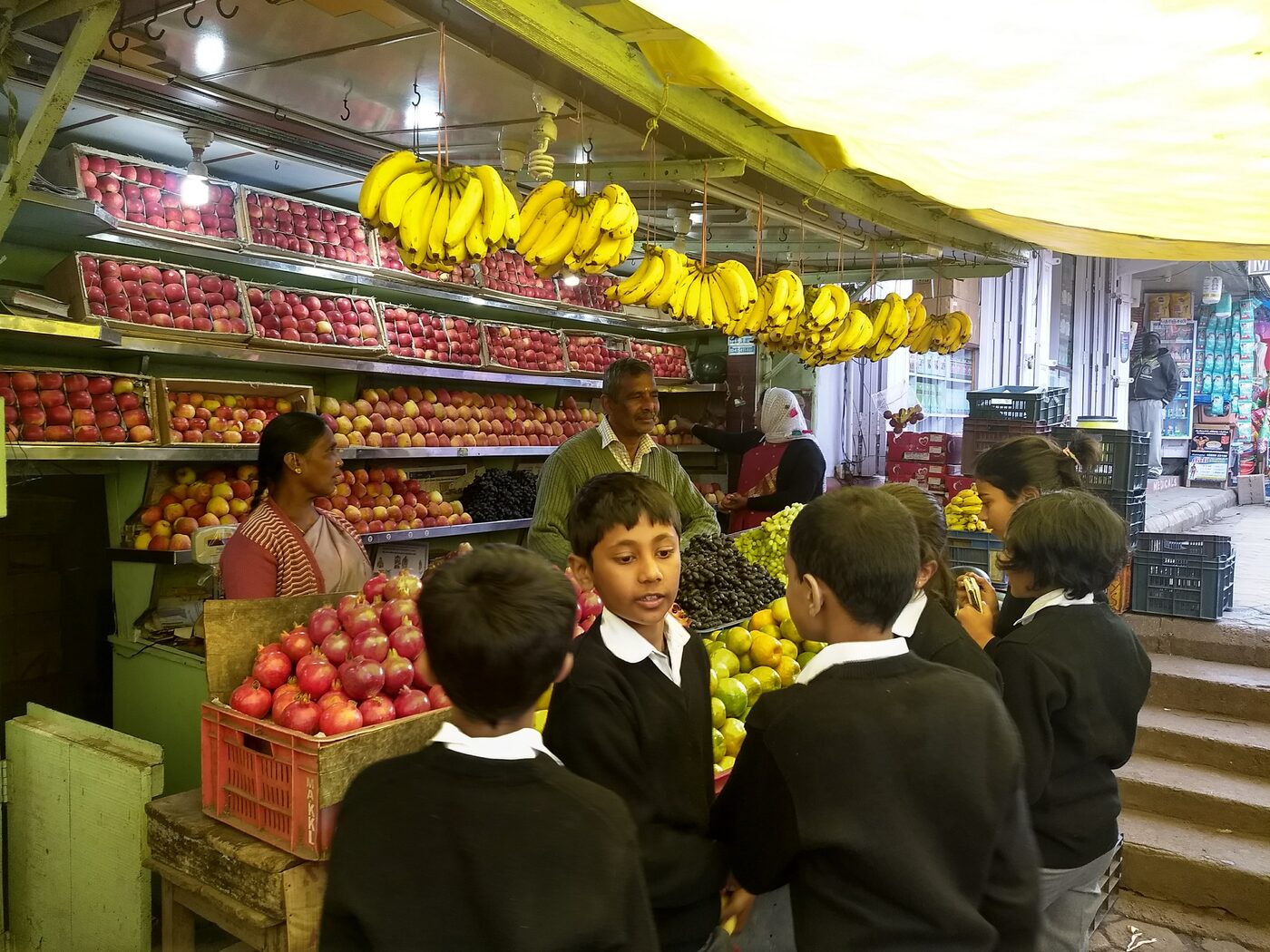 Bananas, pomegranates and grapes on display